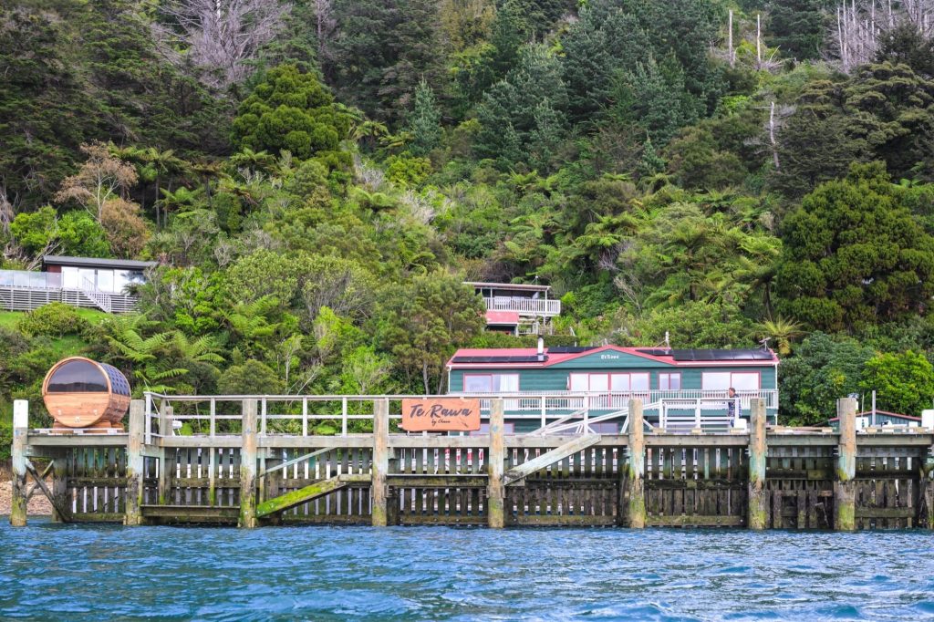 The Te Rawa wharf and the lodge in the bush