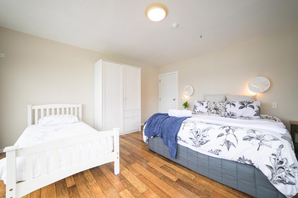 Bedroom with a double and a single